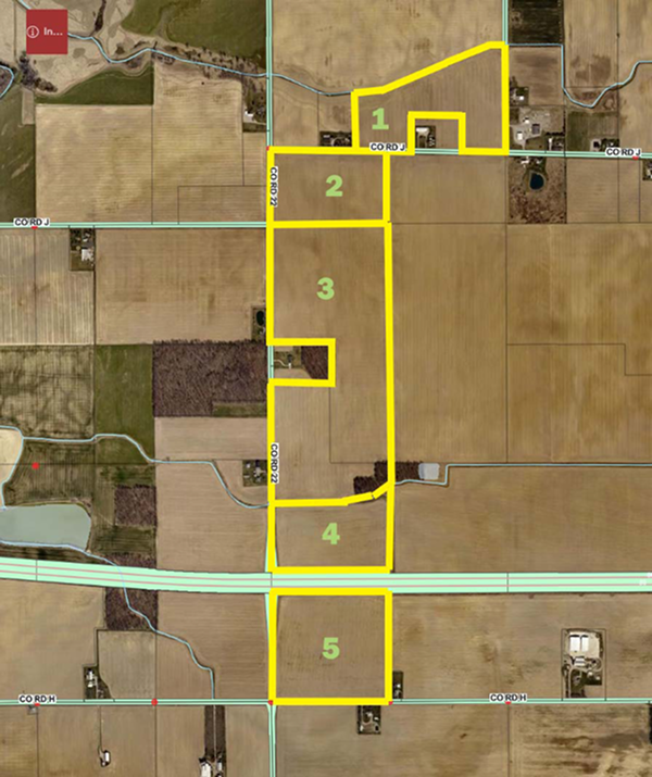 Aerial satellite map showing a farmland property divided into five numbered parcels (1&ndash;5) outlined in yellow, bordered by County Road J to the north, County Road 22 running through the middle, a highway crossing near the bottom, and County Road H to the south. Surrounding fields, a pond, and scattered farmsteads are visible in the background.